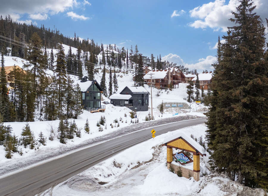Nestled in a picturesque winter wonderland, this stunning property offers a luxurious escape.