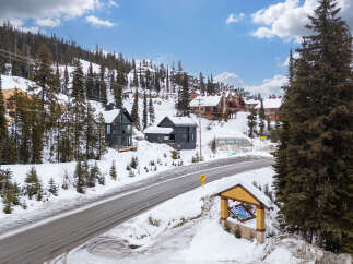 Nestled in a picturesque winter wonderland, this stunning property offers a luxurious escape.