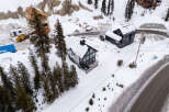 Discover a stunning modern home nestled in a picturesque snowy landscape.
