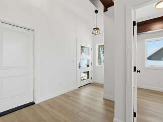 Step into this bright and airy entryway, featuring a modern design with clean lines and neutral tones.