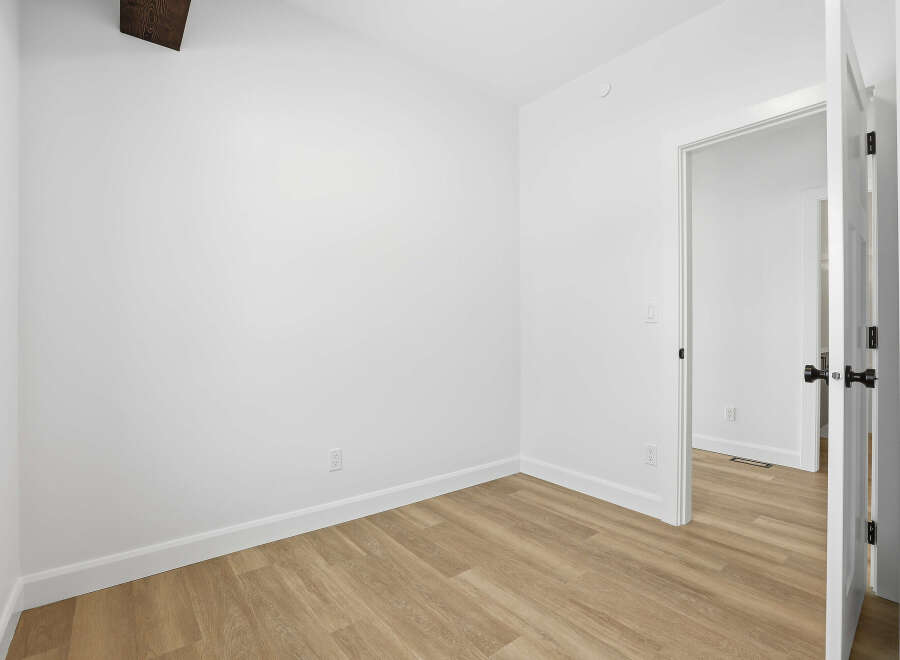 Step into this bright and airy room, perfect for a bedroom or home office.