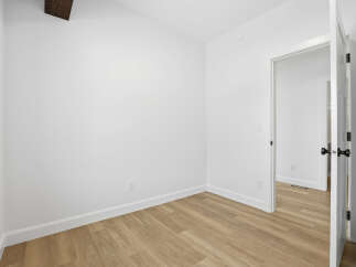 Step into this bright and airy room, perfect for a bedroom or home office.