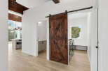 Step into modern elegance with this stunning property featuring a beautifully crafted barn door.