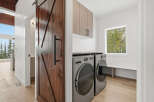 This stunning laundry room features a modern design with a touch of rustic charm.