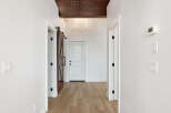 Step into this stunning hallway, showcasing a blend of modern and rustic design elements.