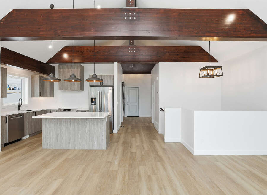 Step into modern elegance with this stunning property, featuring a spacious open-concept design.