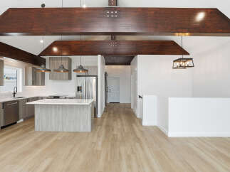 Step into modern elegance with this stunning property, featuring a spacious open-concept design.