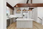 This stunning kitchen boasts a modern design with sleek cabinetry and a spacious island, perfect for both cooking and entertaining.