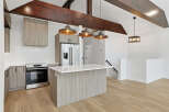 This stunning kitchen boasts modern design with sleek cabinetry and a spacious island, perfect for culinary enthusiasts.