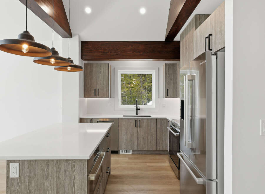 This stunning kitchen boasts modern design elements, including sleek cabinetry and a spacious island.
