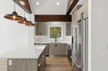This stunning kitchen boasts modern design elements, including sleek cabinetry and a spacious island.