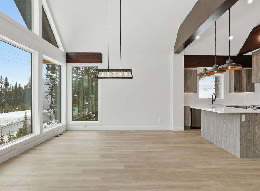 This stunning property boasts a modern open-concept design with high ceilings and expansive windows that flood the space with natural light.