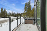 Enjoy breathtaking mountain views from this stunning property, complete with a private balcony and a luxurious hot tub.