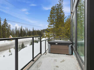 Enjoy breathtaking mountain views from this stunning property, complete with a private balcony and a luxurious hot tub.
