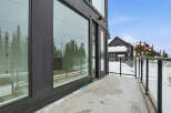 Experience luxury living with this stunning property featuring expansive windows and a private balcony.