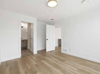 Step into this bright and airy space, featuring a modern design and neutral color palette.