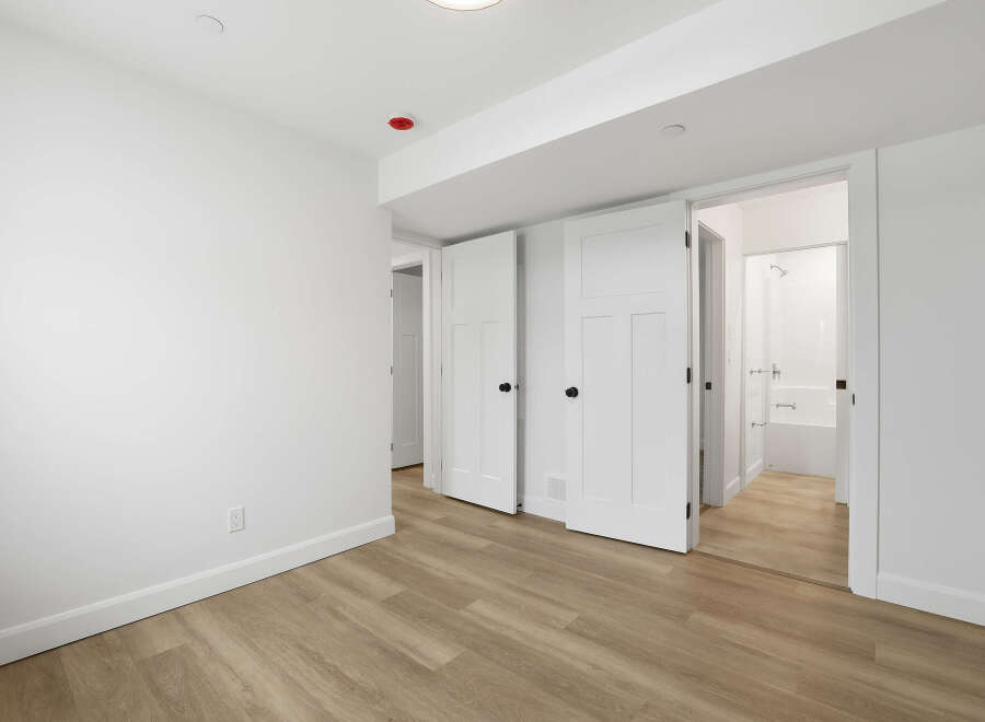 Step into this bright and airy space, featuring pristine white walls and modern finishes.