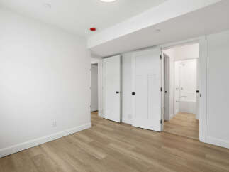 Step into this bright and airy space, featuring pristine white walls and modern finishes.