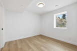 This bright and airy room features a neutral color palette, creating a versatile space for any design style.