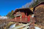Discover this charming chalet nestled in a picturesque mountain setting.
