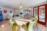 Experience luxury living in this stunning property, featuring a spacious dining area with a modern design.