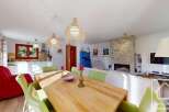Discover the charm of this inviting property, featuring a spacious living area perfect for gatherings.
