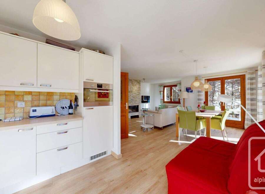 This stunning property boasts a modern kitchen with sleek cabinetry and top-of-the-line appliances, perfect for culinary enthusiasts.