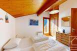 Discover the charm of this cozy bedroom, perfect for a relaxing getaway.