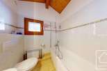 This charming bathroom features a bright and airy design, perfect for relaxation.
