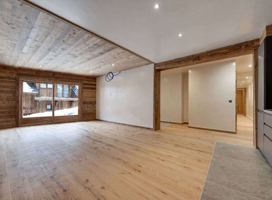 This stunning property boasts a warm and inviting interior with beautiful wooden accents throughout.
