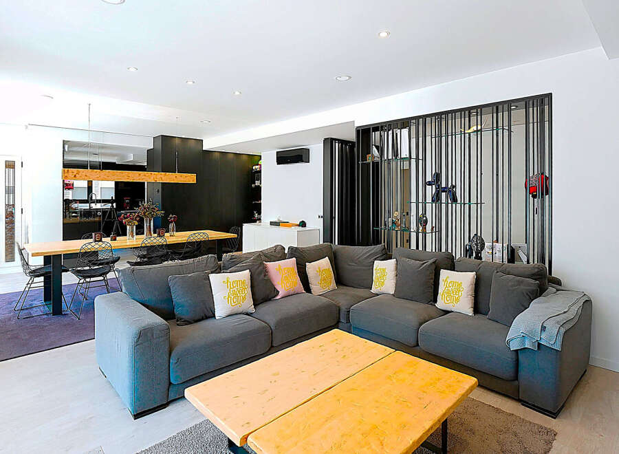 Step into modern luxury with this stunning living space! Featuring a spacious open layout, this home boasts a stylish sectional sofa, perfect for relaxation.