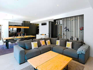 Step into modern luxury with this stunning living space! Featuring a spacious open layout, this home boasts a stylish sectional sofa, perfect for relaxation.