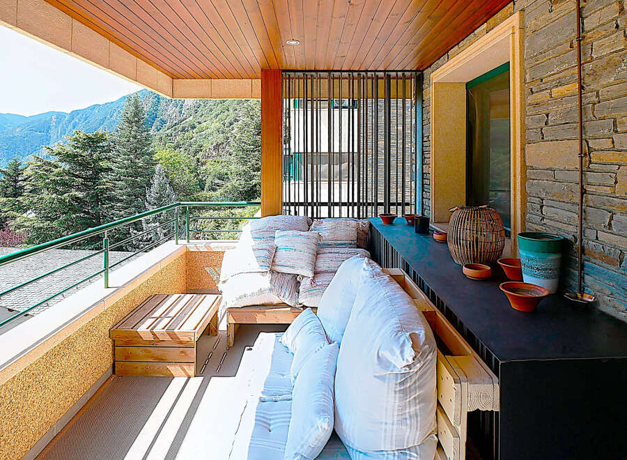 Enjoy breathtaking mountain views from this stunning balcony.