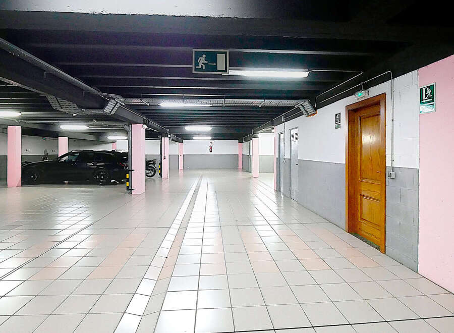 Explore this well-lit, spacious parking garage, perfect for secure vehicle storage.