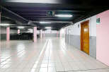 Explore this well-lit, spacious parking garage, perfect for secure vehicle storage.