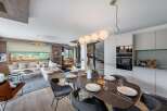 Experience luxury living in this stunning property, featuring a modern kitchen with sleek appliances and a spacious dining area perfect for entertaining.