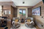 This cozy living space features beautiful wood paneling, creating a warm and inviting atmosphere.