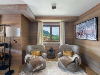 This cozy living space features beautiful wood paneling, creating a warm and inviting atmosphere.