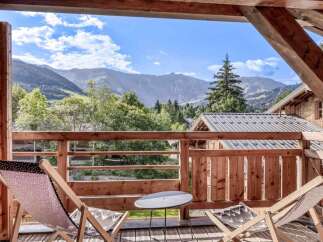 Enjoy breathtaking mountain views from this charming balcony.