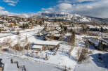 Nestled in a picturesque winter wonderland, this property offers a serene escape with stunning mountain views.