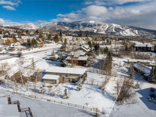Nestled in a picturesque winter wonderland, this property offers a serene escape with stunning mountain views.