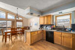 This stunning kitchen boasts a warm and inviting atmosphere, perfect for culinary creations and family gatherings.