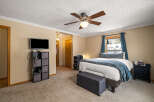 This inviting bedroom features a cozy atmosphere with neutral tones and ample natural light.