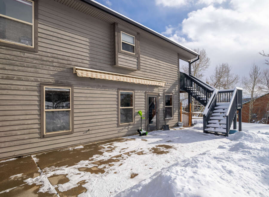 This charming property boasts a beautiful exterior with a two-story design and a welcoming atmosphere.