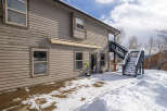 This charming property boasts a beautiful exterior with a two-story design and a welcoming atmosphere.