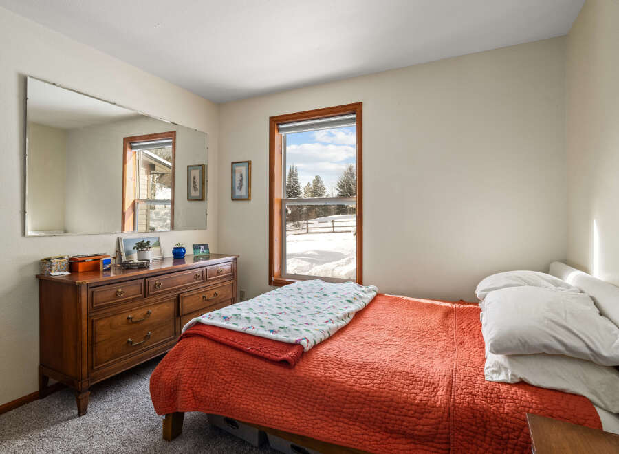 This cozy bedroom features a warm and inviting atmosphere, perfect for relaxation.