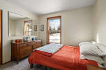 This cozy bedroom features a warm and inviting atmosphere, perfect for relaxation.