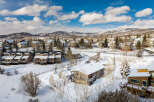 Nestled in a serene winter landscape, this charming property offers a cozy retreat.