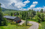 Nestled amidst lush greenery and rolling hills, this property offers a serene mountain retreat.
