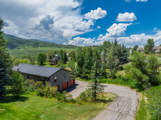 Nestled amidst lush greenery and rolling hills, this property offers a serene mountain retreat.